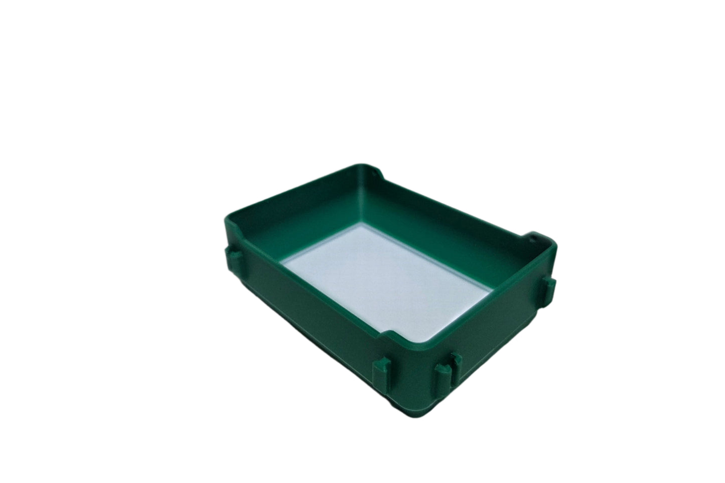 Green plastic box with a white interior on a white background