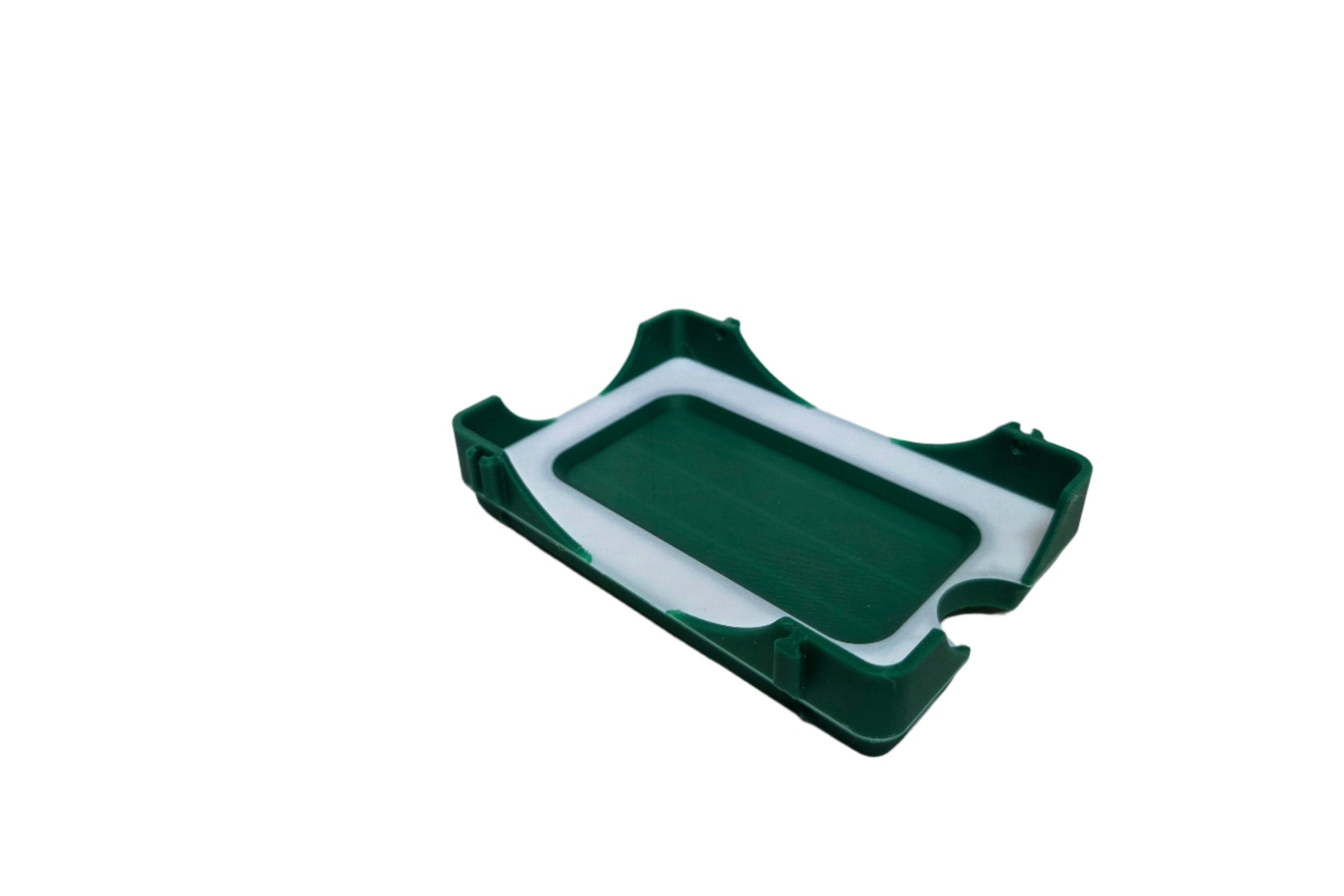 Green and white plastic tray on a white background
