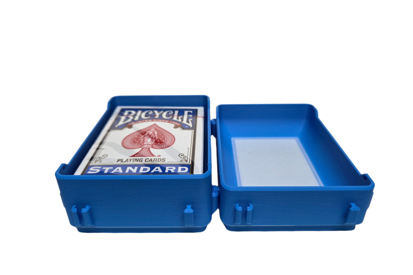 Blue plastic case with a deck of Bicycle playing cards on a white background