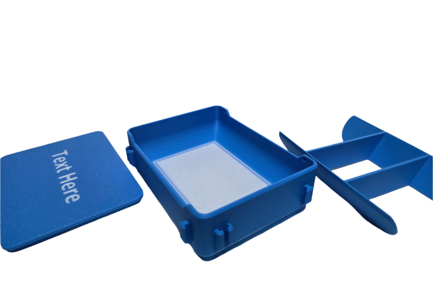 Blue plastic box with text 'Text Here' on a white background