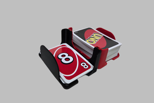 Two connected side by side card trays with Uno cards on a white background